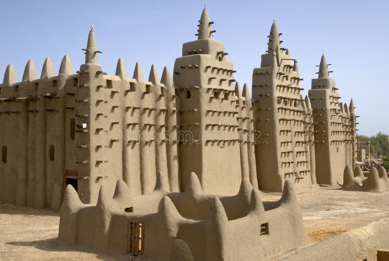 The Great Mosque of Djenne. Mali. Africa. The Great Mosque of Djenné is the largest mud brick or adobe building in the world and is considered by many architects to be the greatest achievement of the Sudano-Sahelian architectural style, with definite Islamic influences. It was designated a World Heritage Site by UNESCO in 1988. The Great Mosque of Djenne. Mali. Africa. The Great Mosque of Djenné is the largest mud brick or adobe building in the world and is considered by many architects to be the greatest achievement of the Sudano-Sahelian architectural style, with definite Islamic influences. It was designated a World Heritage Site by UNESCO in 1988.