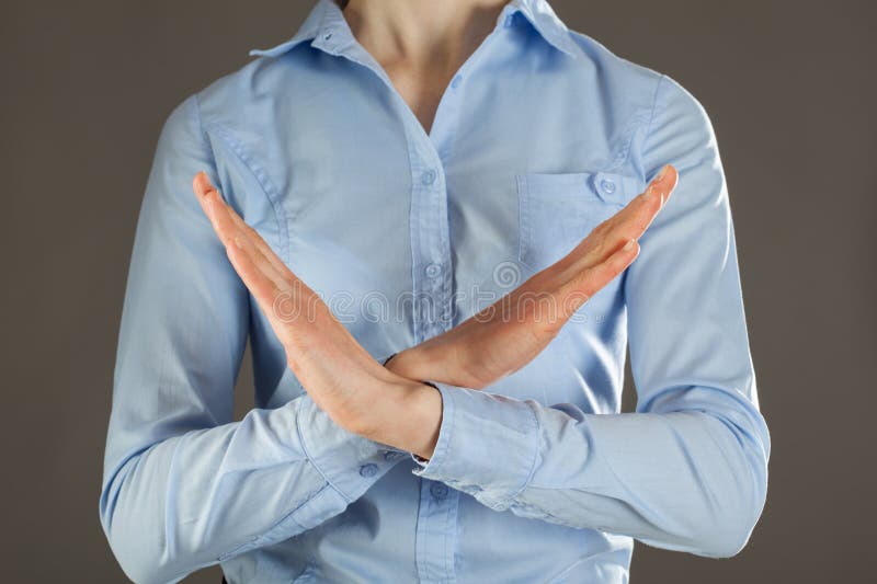 Woman's hands rejecting of something, grey background. Woman's hands rejecting of something, grey background