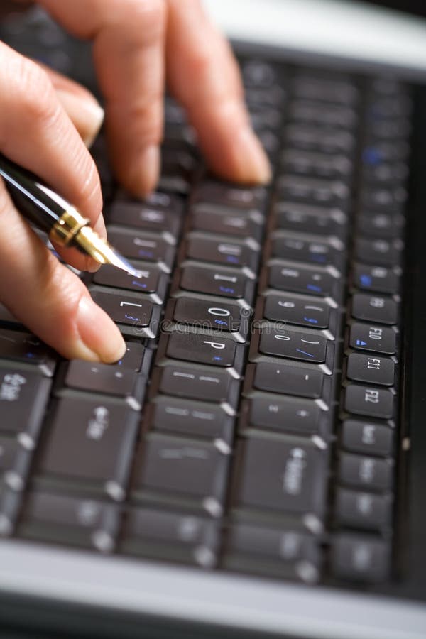 Woman hands on laptop keyboard - closeup, shallow depth of field. Woman hands on laptop keyboard - closeup, shallow depth of field