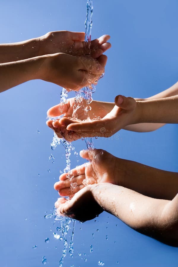 Close-up of six human hands enjoying pure water with open palms on grey background. Close-up of six human hands enjoying pure water with open palms on grey background