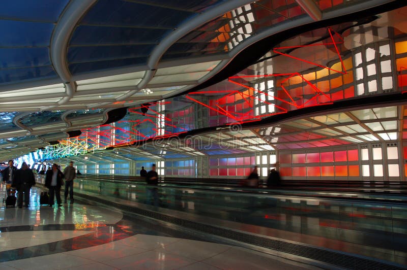 Travelers walk through The Sky`s the Limit, an art work installed between terminals at O`Hare International Airport, Chicago. Travelers walk through The Sky`s the Limit, an art work installed between terminals at O`Hare International Airport, Chicago