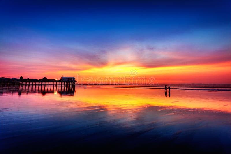 Pier at Old Orchard Beach, Maine, in vivid light before sunrise. Pier at Old Orchard Beach, Maine, in vivid light before sunrise