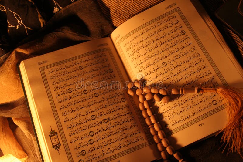 Holy Koran book and rosary in brown light mood. Holy Koran book and rosary in brown light mood