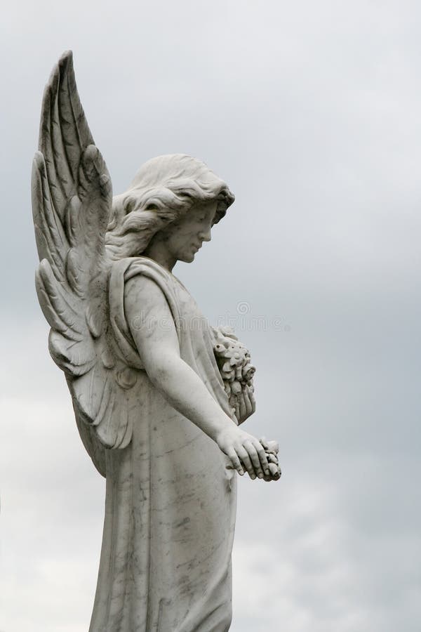 Angel sculpture in public cemetery. Angel sculpture in public cemetery.