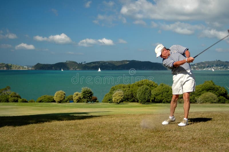 Senior golfer with harbor in background. Senior golfer with harbor in background