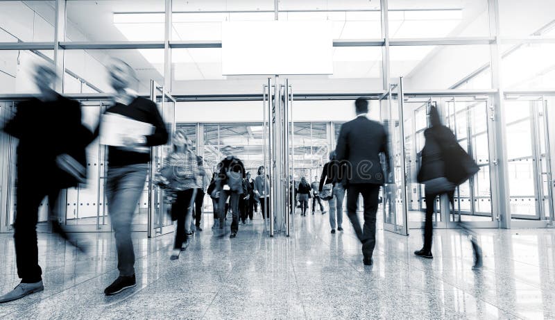 Business people rushing in a entrance at a trade show. ideal for websites and magazines layouts. Business people rushing in a entrance at a trade show. ideal for websites and magazines layouts