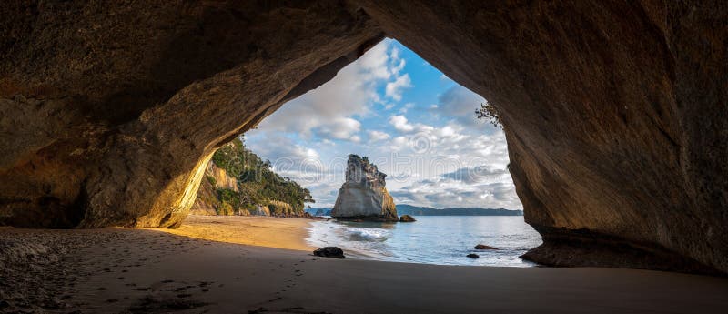 Panoramic view of Cathedral Cove at sunrise, The Coromandel peninsula, New Zealand. Panoramic view of Cathedral Cove at sunrise, The Coromandel peninsula, New Zealand.