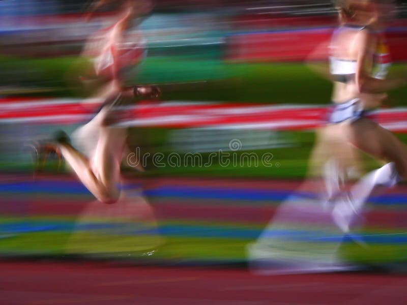 Two athletes women running motion blur. Two athletes women running motion blur