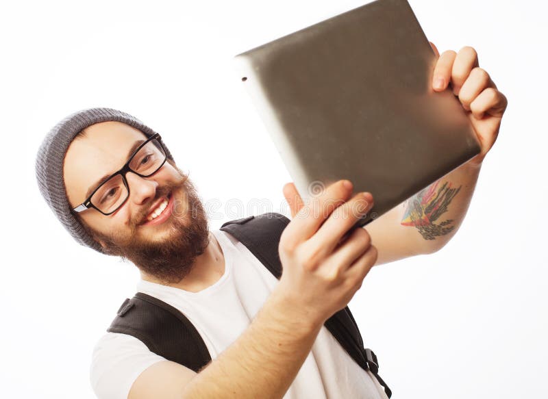 De jonge gebaarde tablet van de mensenholding stock foto's