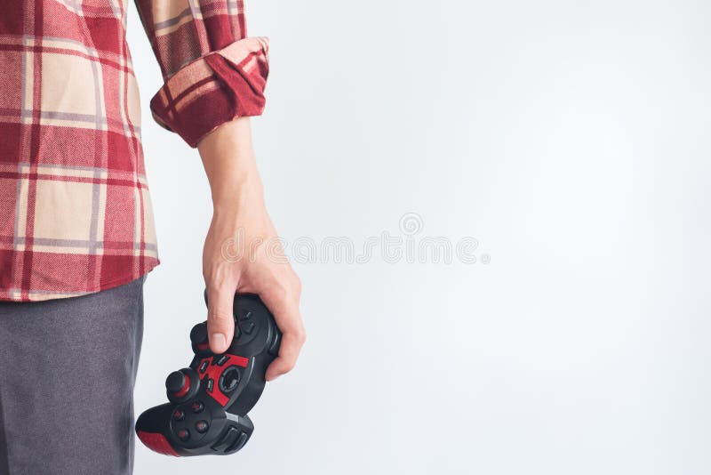 De jonge Mensen dragen de rode Scott-bedieningshendel van de de Handholding van het patroonoverhemd gamepad royalty-vrije stock foto De jonge Mensen dragen de rode Scott-bedieningshendel van de de Handholding van het patroonoverhemd gamepad royalty-vrije stock foto