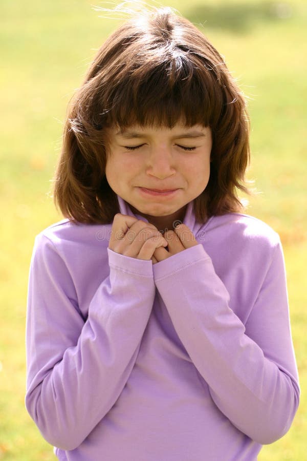 An adorable young Latin American girl in the 5-8 year old age range. She is wearing a pink purple turtleneck and has brown hair lowing in the sun. Her expression can show deep thought, thinking hard, prayer, sadness, pain. An adorable young Latin American girl in the 5-8 year old age range. She is wearing a pink purple turtleneck and has brown hair lowing in the sun. Her expression can show deep thought, thinking hard, prayer, sadness, pain