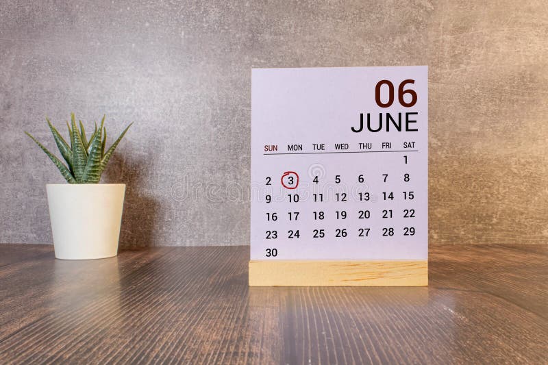 June 3. Date of June month. Number Cube with a flower and notebook on Diamond wood table for the background. June 3. Date of June month. Number Cube with a flower and notebook on Diamond wood table for the background