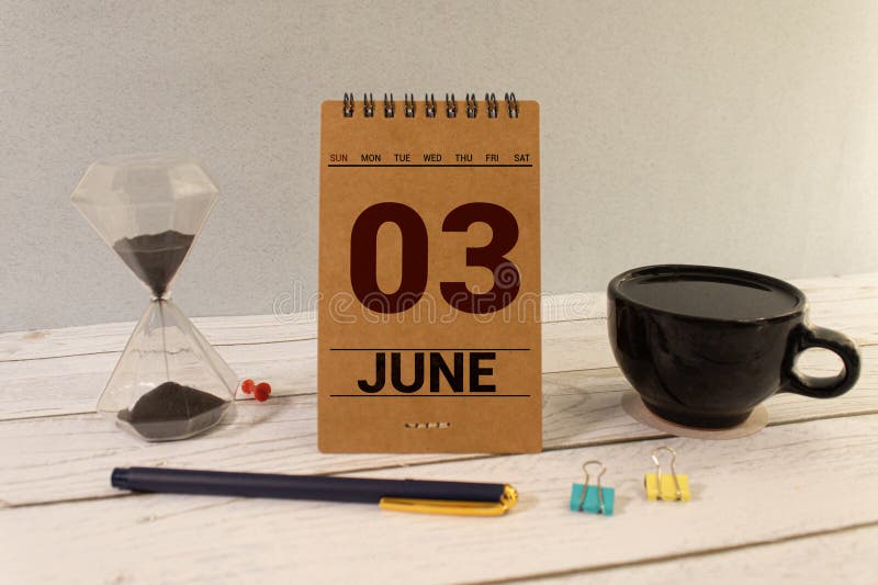 June 3. Date of June month. Number Cube with a flower and notebook on Diamond wood table for the background. June 3. Date of June month. Number Cube with a flower and notebook on Diamond wood table for the background