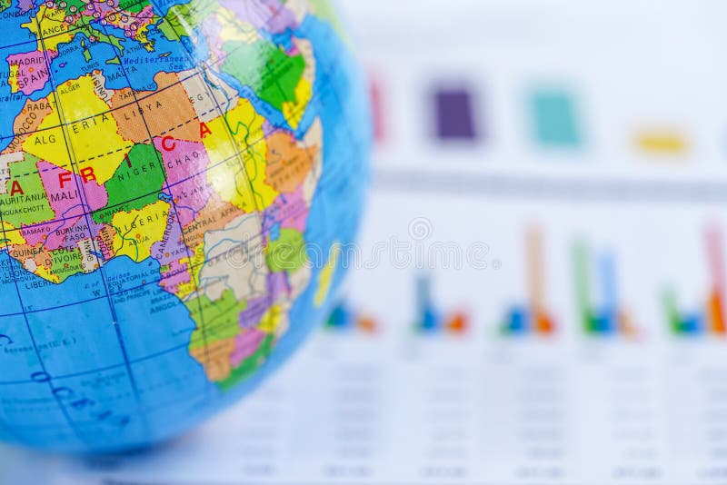 Chart graph paper with globe world Africa map on . Finance, Account, Statistics, Investment, Analytic research data economy and Business company meeting concept. Chart graph paper with globe world Africa map on . Finance, Account, Statistics, Investment, Analytic research data economy and Business company meeting concept.