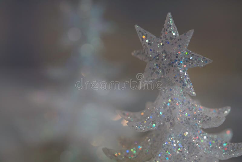 Sparkly white holiday Christmas tree decoration, close up still life, artistic selective focus, intentional shallow depth of field. Sparkly white holiday Christmas tree decoration, close up still life, artistic selective focus, intentional shallow depth of field