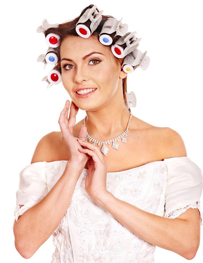 Woman with hair curlers on head wear in wedding dress . Woman with hair curlers on head wear in wedding dress .