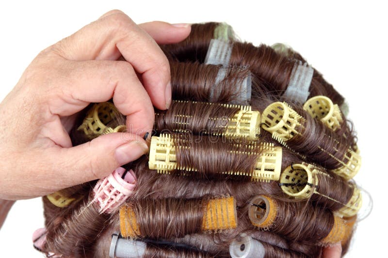 Senior citizen adjusting bobby pin Close up view back of the head hair roller curlers. Senior citizen adjusting bobby pin Close up view back of the head hair roller curlers