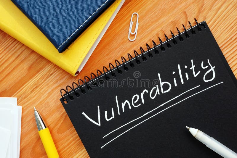 Vulnerability is written in white pencil on the black page. Vulnerability is written in white pencil on the black page.