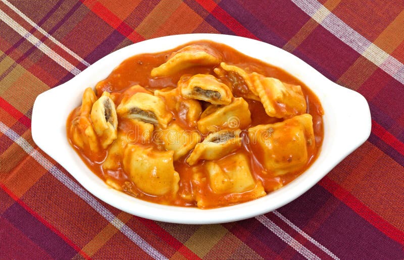 An overhead view of a delicious bowl of bite size ravioli. An overhead view of a delicious bowl of bite size ravioli.