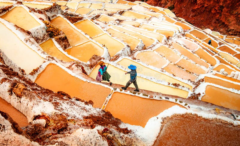 Workers at Salinas de Maras near Cusco, salt extraction in Peru. Workers at Salinas de Maras near Cusco, salt extraction in Peru