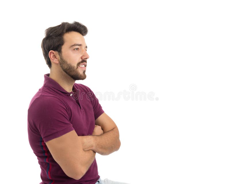 Profile man is with an interested look. Consumer concept concerned, offer. Beautiful and bearded person. He is wearing a magenta polo shirt. White background, isolated. Profile man is with an interested look. Consumer concept concerned, offer. Beautiful and bearded person. He is wearing a magenta polo shirt. White background, isolated.