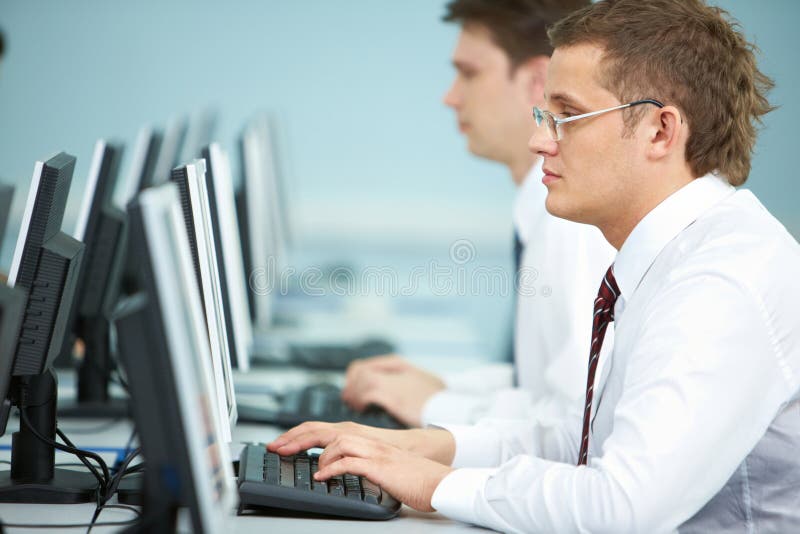 Close-up of a businessman working on computer. Close-up of a businessman working on computer