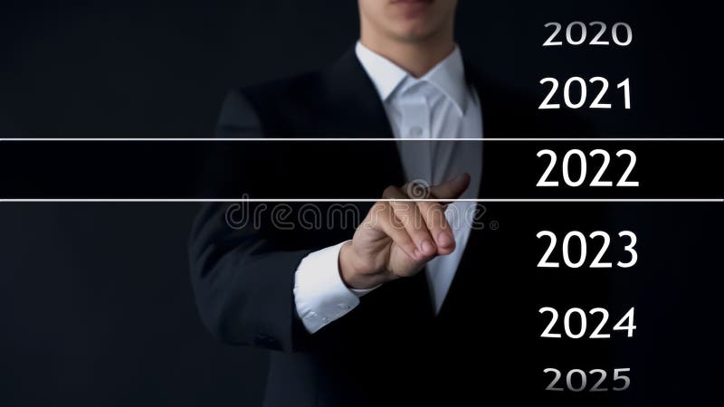 Man finds 2022 year in virtual archive, collection of statistics, annual reports, stock photo. Man finds 2022 year in virtual archive, collection of statistics, annual reports, stock photo