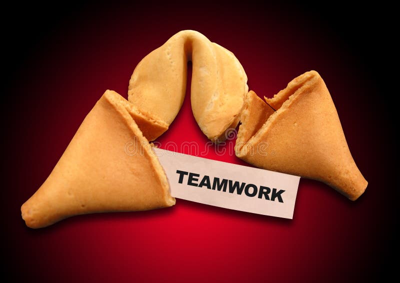 A photo of a fortune cookie with a teamwork theme. A photo of a fortune cookie with a teamwork theme