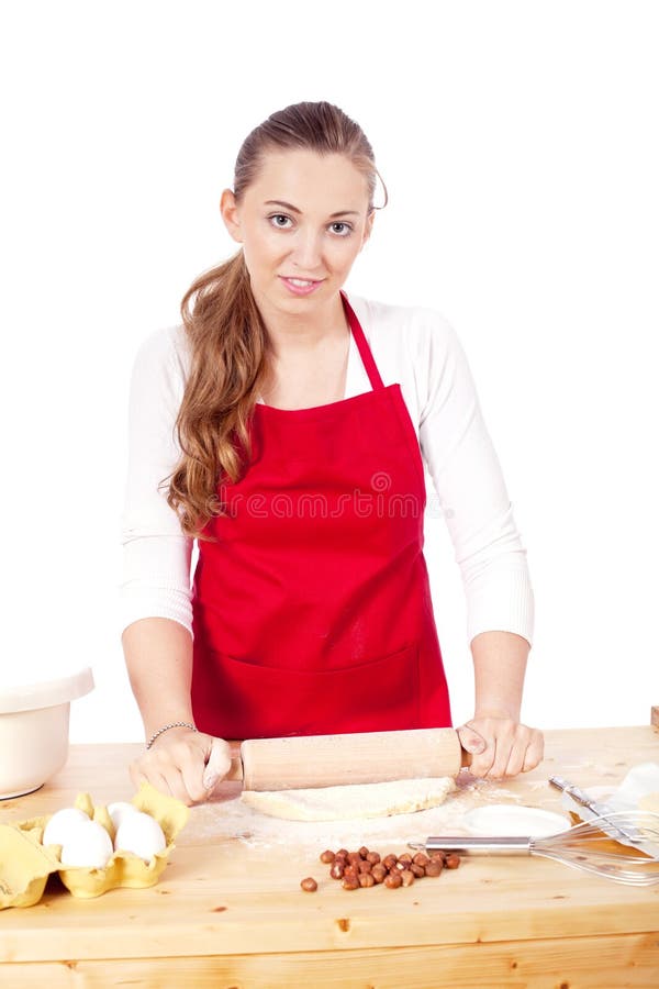 De mooie vrouw bakt koekjes voor Kerstmis stock foto's De mooie vrouw bakt koekjes voor Kerstmis stock foto's