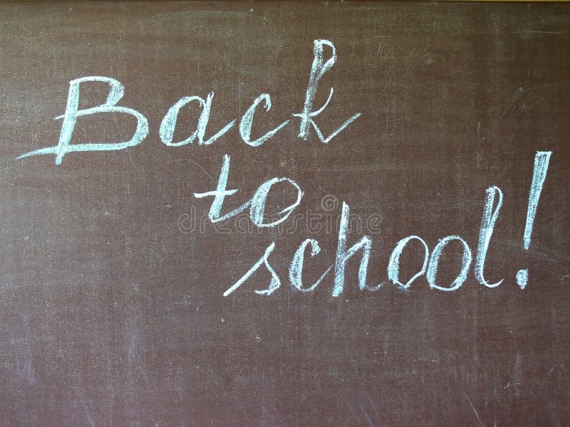 Back to school. Inscription on a chalkboard. Back to school. Inscription on a chalkboard