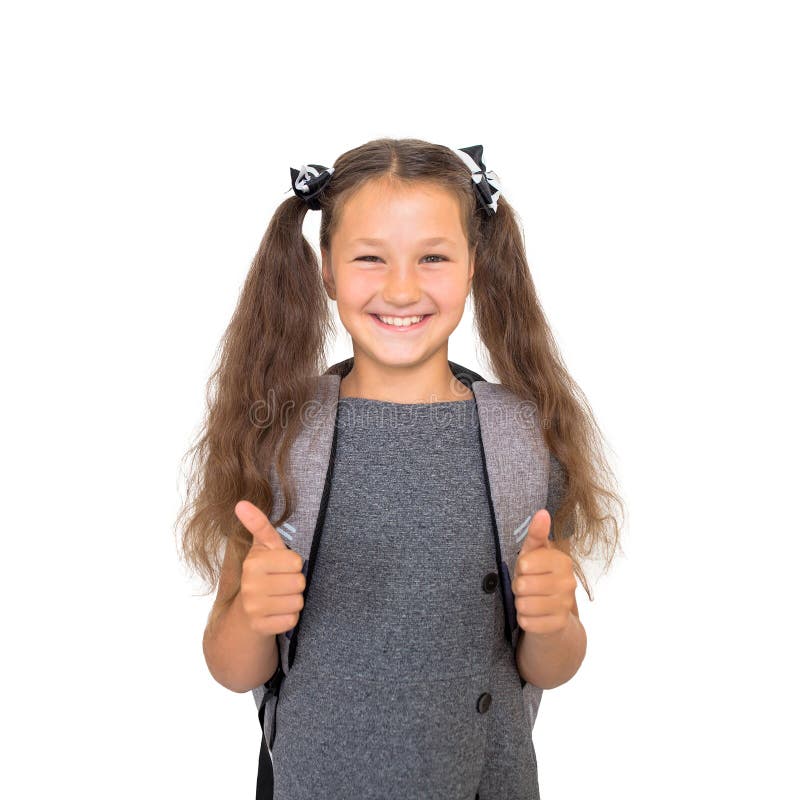 De nouveau à l'école ! L'écolier montre des pouces image libre de droits De nouveau à l'école ! L'écolier montre des pouces image libre de droits