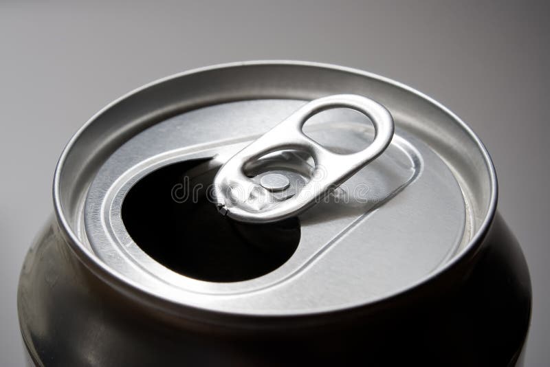 A closeup shot of a soda can top. A closeup shot of a soda can top