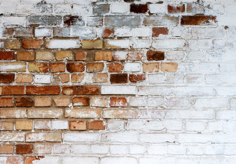 Old chipped white brick wall texture background, whitewashed grungy brick wall with peeling plaster layer, abstract red white vintage background. Old chipped white brick wall texture background, whitewashed grungy brick wall with peeling plaster layer, abstract red white vintage background