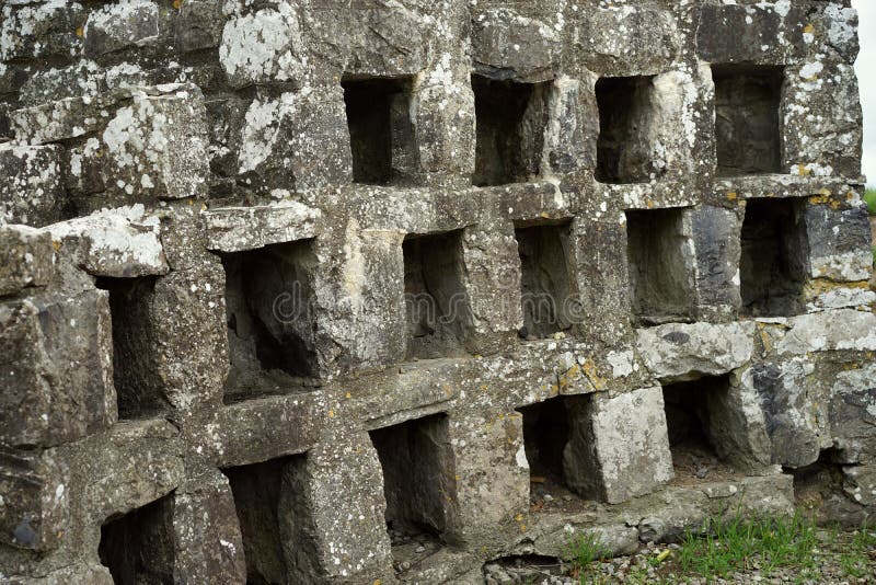 This medieval stone dovecote with individual, square nest holes for doves and pigeons was an important feature at many castles. It brings to mind modern work cubicles and apartments. This medieval stone dovecote with individual, square nest holes for doves and pigeons was an important feature at many castles. It brings to mind modern work cubicles and apartments.