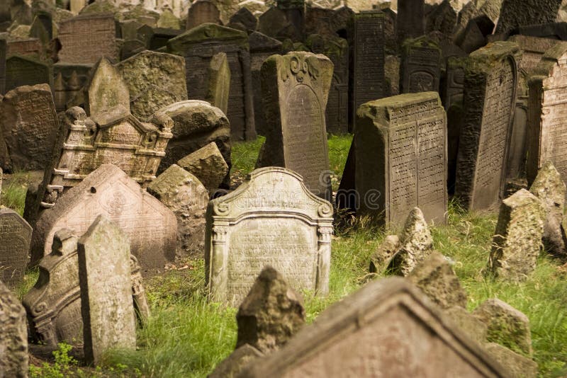 A view of the old Jewish cemetery in Prague. The tombstones are uneven due to age. A view of the old Jewish cemetery in Prague. The tombstones are uneven due to age.