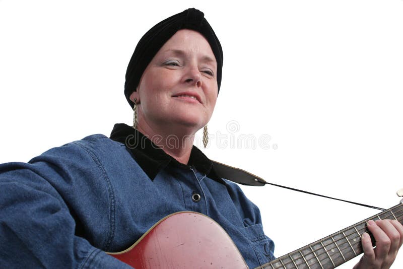 A cancer survivor relaxing and playing her guitar. A cancer survivor relaxing and playing her guitar.