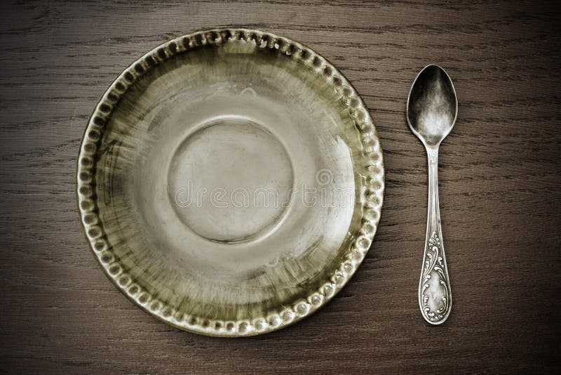 De plaat en de lepel van het dessert royalty-vrije stock afbeelding De plaat en de lepel van het dessert royalty-vrije stock afbeelding