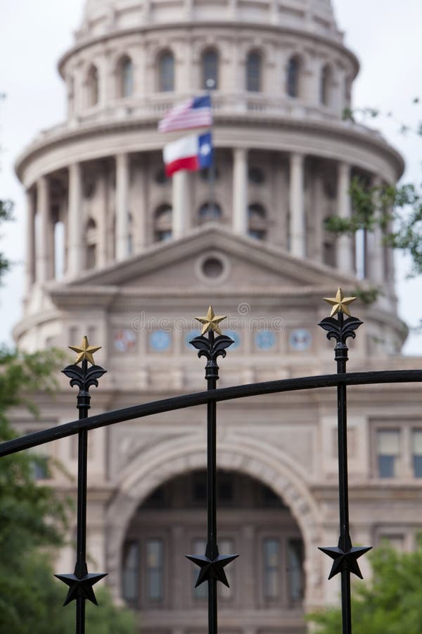 Wrought iron gate with gold stars in front of the Texas state capitol in Austin. Shallow depth of field for effect. Wrought iron gate with gold stars in front of the Texas state capitol in Austin. Shallow depth of field for effect.