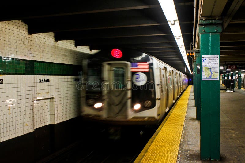 Subway train roars by at a NYC subway station. Subway train roars by at a NYC subway station.