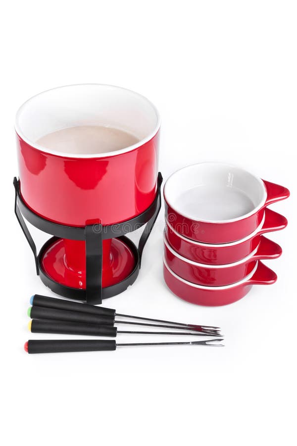 De pot van de fondue met platen royalty-vrije stock afbeeldingen De pot van de fondue met platen royalty-vrije stock afbeeldingen