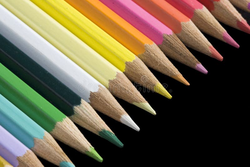 Background / wallpaper: color pencils over black background. Background / wallpaper: color pencils over black background
