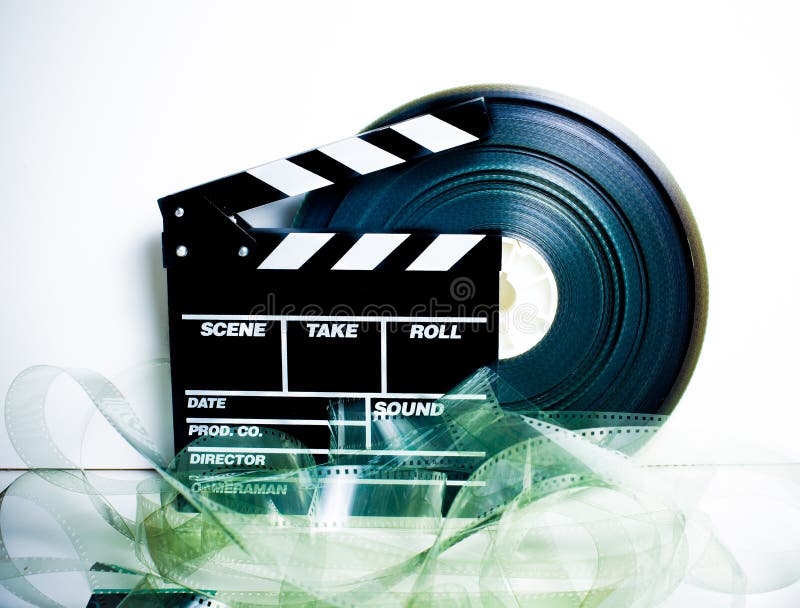 De raad van de filmklep en 35 mm-filmspoel stock foto De raad van de filmklep en 35 mm-filmspoel stock foto