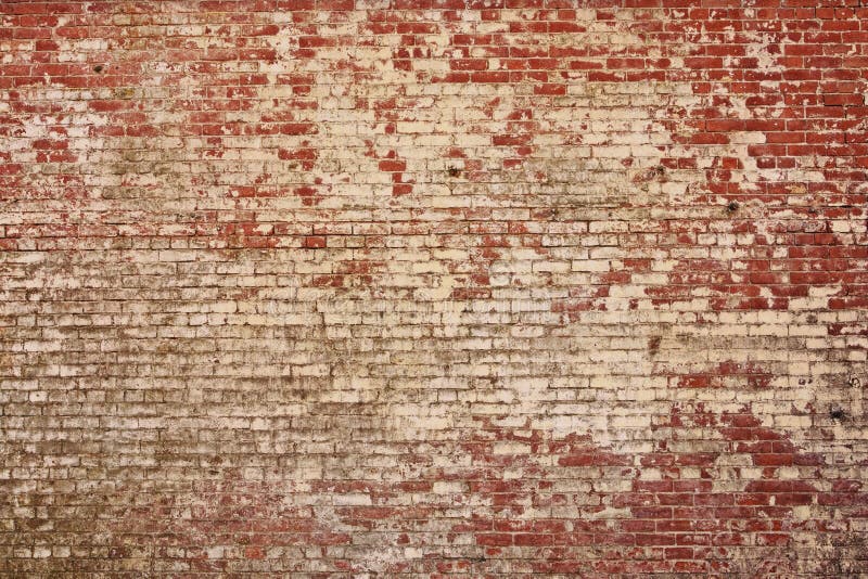 Vintage style old red brick wall. Lots of detail and texture in this wall as the paint is peeling off. Vintage style old red brick wall. Lots of detail and texture in this wall as the paint is peeling off