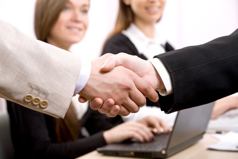 Shaking hands of two business people. Shaking hands of two business people