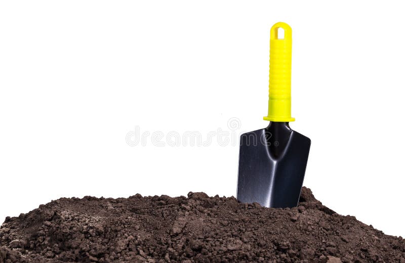 De spade van de tuin in de grond