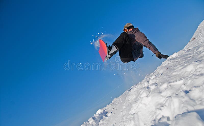 De Sprong van Snowboarder in Lucht, het Vliegen van de Sneeuw