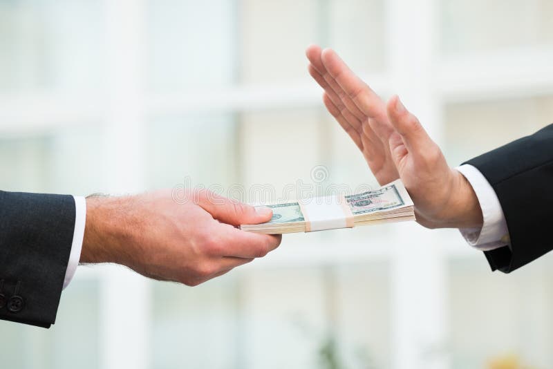 Cropped hand of businessman refusing to take bribe from partner outdoors. Cropped hand of businessman refusing to take bribe from partner outdoors