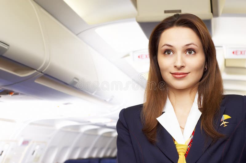 De stewardess van de lucht (stewardess) royalty-vrije stock foto De stewardess van de lucht (stewardess) royalty-vrije stock foto