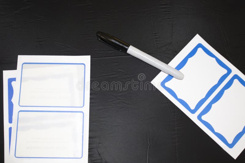 Stick on name tags and a market laying on a plastic tablecloth so guests can write their names and wear them. Stick on name tags and a market laying on a plastic tablecloth so guests can write their names and wear them.