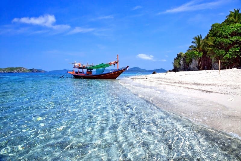 The beaches of tropical sea with boats and beautiful sky. The beaches of tropical sea with boats and beautiful sky.